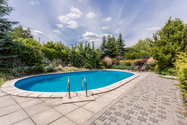 Oval swimming pool in a garden area, surrounded by plants New Mexico